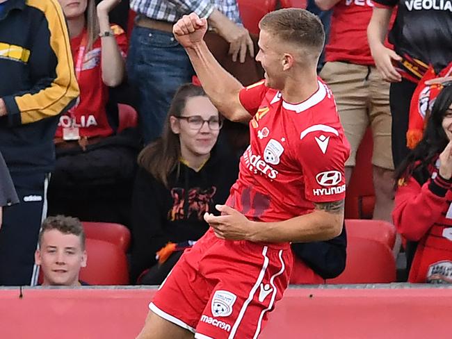 ADELAIDE, AUSTRALIA - NOVEMBER 10: Riley McGree of Adelaide United  celebrates after scoring his teams first goal during the Round 5 A-League match between Adelaide United and Brisbane Roar at Coopers Stadium on November 10, 2019 in Adelaide, Australia. (Photo by Mark Brake/Getty Images)
