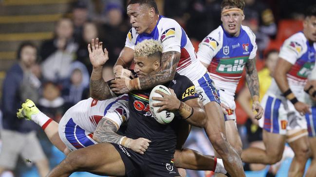 SYDNEY, AUSTRALIA – APRIL 22: Viliame Kikau of the Panthers is tackled Tyson Frizell of the Knights during the round seven NRL match between the Penrith Panthers and the Newcastle Knights at BlueBet Stadium, on April 22, 2021 in Sydney, Australia. (Photo by Jason McCawley/Getty Images)