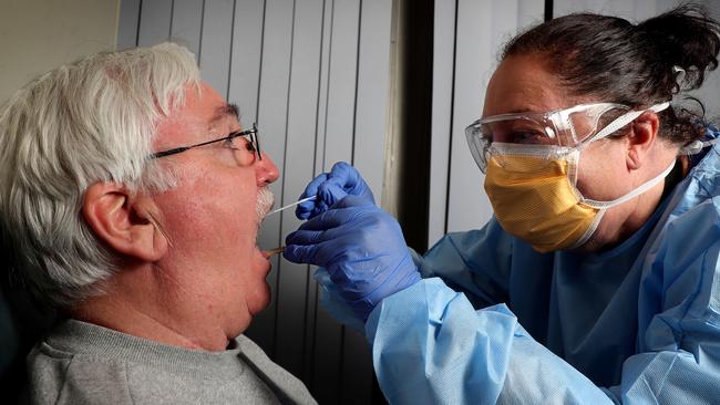 Chris Kinder is checked by nurse Tracy Szolnoki at Sir Charles Gairdner Covid clinic. Picture: Colin Murty