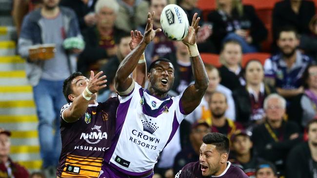 Suliasi Vunivalu takes the high ball to score a try for the Storm. Picture: Darren England