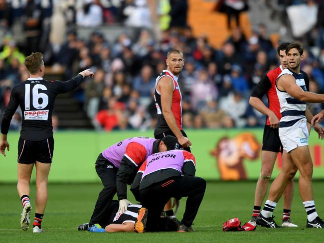 Dylan Roberton is attended to by St Kilda medicos. Picture: AAP