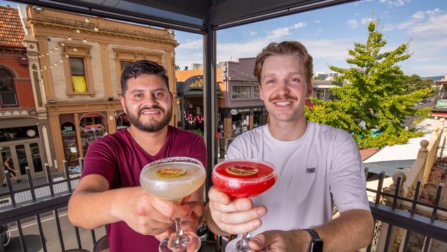 Javier Chiquillo, 35, and Zac Sipek, 24, enjoying margaritas at the Refreshment Club on Rundle Street. Picture: Ben Clark