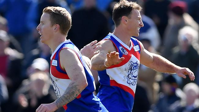 Louis Hill and Brent Harvey celebrate a goal during the NFL Division 2 grand final between North Heidelberg and Diamond Creek. Picture: Andy Brownbill.