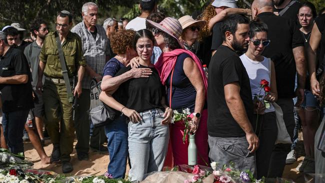 Relatives and friends mourn during the funeral of Toni Levy who was killed by Palestinian Hamas militants on October 7, in Kibbutz Be’eri. Picture: AFP