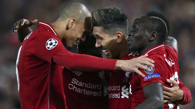 Liverpool's Roberto Firmino, centre celebrates after scoring his side's second goal during the Champions League quarter-final, first leg, against FC Port this week. Picture: AP Photo/Dave Thompson