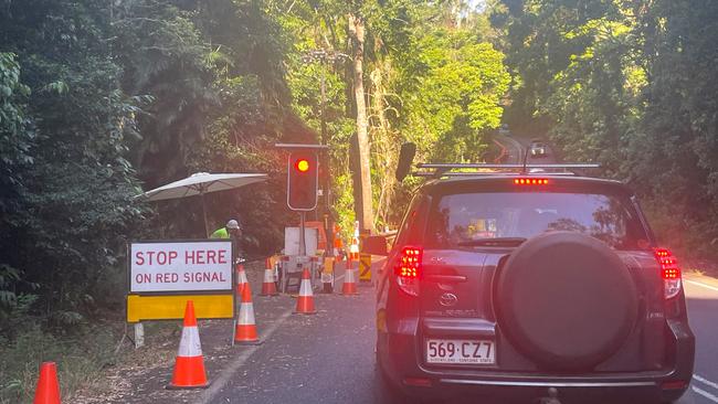 Mobile traffic lights have been in operation at the Streets Creek crossing since December 2023 when landslides damaged the road. Picture: Peter Carruthers