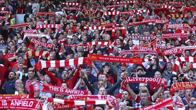 Liverpool supporters cheer prior to the English Premier League soccer match between Liverpool and Wolverhampton Wanderers at the Anfield stadium. Picture: AP Photo/Dave Thompson