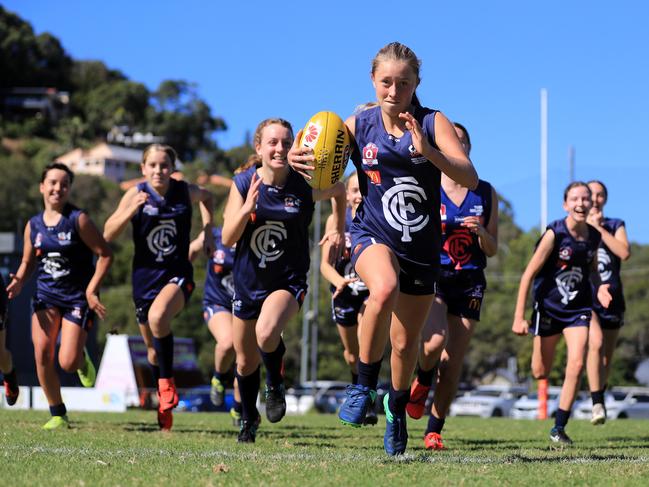 The Coolangatta Tweed Heads Australian football Club girls under-13’S celebrate the clubs plans for a development worth just under $1 million at Eximm Oval and has big plans for it's juniors and seniors. Picture Scott Powick