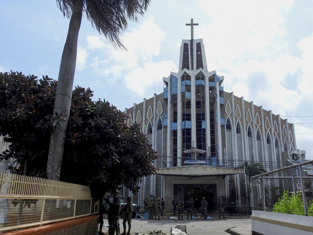 The first explosion went off inside the cathedral on Jolo Island in Sulu Province, and was followed by a second blast outside. Picture: AFP