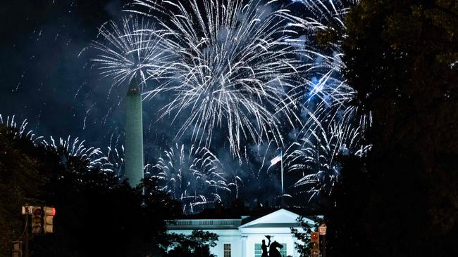 The silhouette of Andrew Jackson's statue is seen as fireworks paint the sky above the obelisk of the Washington Monument. Picture: AFP