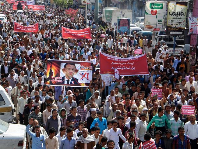 Demonstrators march with banners during a rally protesting the comments of French President Emmanuel Macron over Prophet Mohammed cartoons. Picture: AFP