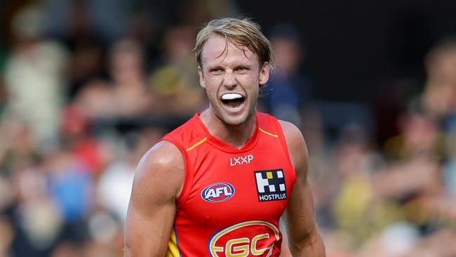 GOLD COAST, AUSTRALIA - MARCH 09: Jack Lukosius of the Suns celebrates a goal during the 2024 AFL Opening Round match between the Gold Coast SUNS and the Richmond Tigers at People First Stadium on March 09, 2024 in Gold Coast, Australia. (Photo by Russell Freeman/AFL Photos via Getty Images)