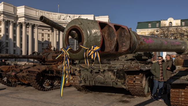 People look at destroyed Russian tanks on display in Mykhailivskyi Square, Kyiv. Picture: Getty Images.