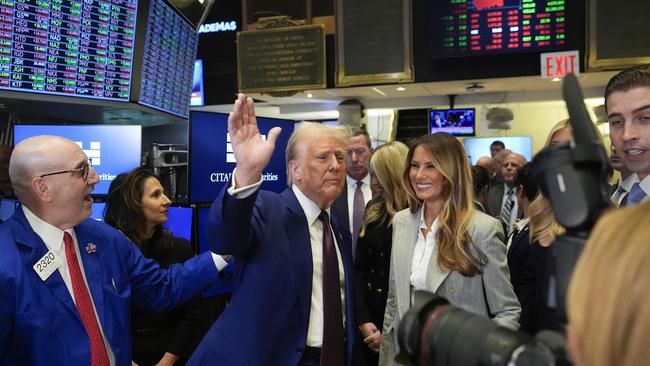 President-elect Donald Trump, with NYSE president Lynn Martin, Melania Trump and trader Peter Giacchi on the floor of the New York Stock Exchange. Picture: Alex Brandon/AP Photo