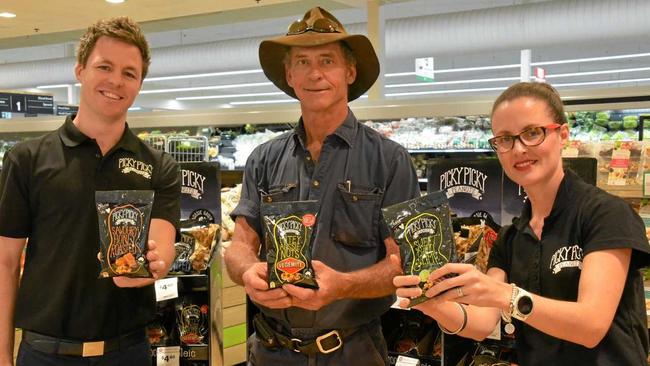 MITEY NUTS: Dean Leibbrandt, Julian Cross and Toni Cohen give Kingaroy shoppers a taste of the new Picky Picky Peanut flavours at Woolworths. Picture: Jessica McGrath