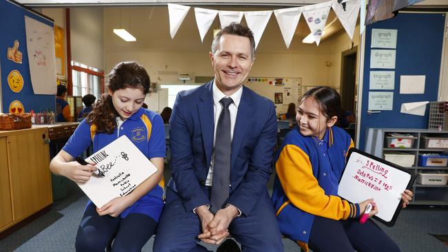 Pictured at Marrickville Public School in Sydney is Year 6 student Ivy Forsyth, Education Minister Jason Clare and Year 6 student Ruby Turner-Carroll ahead of the 2022 Prime Minister’s Spelling Bee. Picture: Richard Dobson