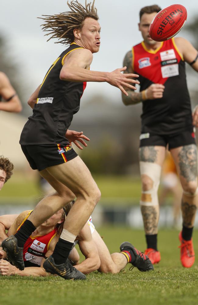 Dingley’s Lucas Walmsley sets sights on the ball.