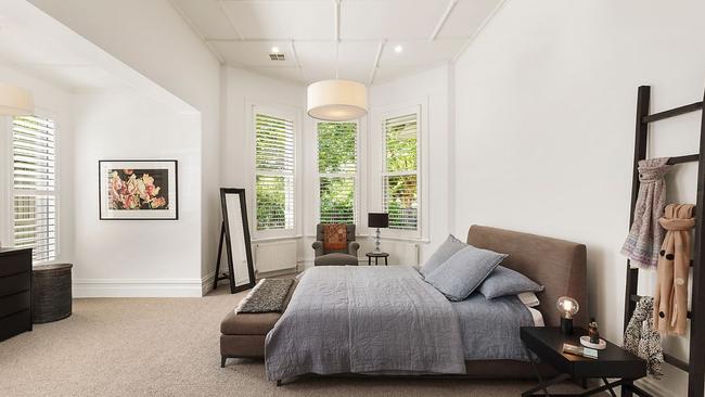 The home’s spacious main bedroom has a bay window.