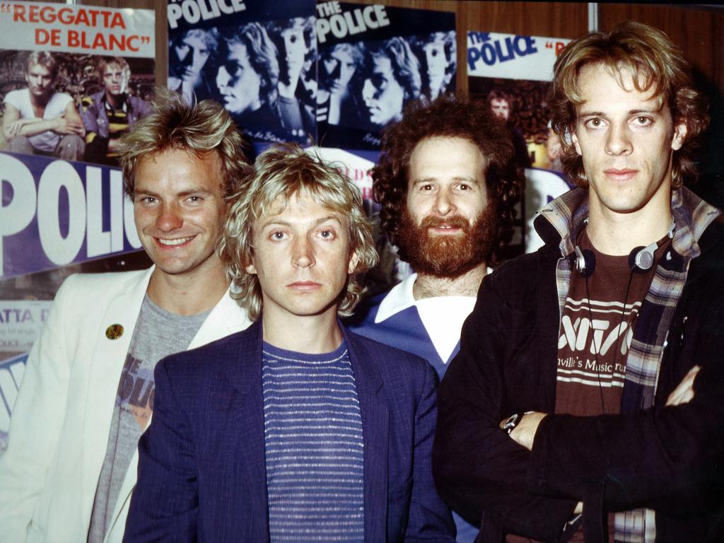 Michael Gudinski brought many acts to Australia starting with The Police, pictured here in 1980. Pictured L-R: Sting, guitarist Andy Summers, Gudinksi, and drummer Stewart Copeland.