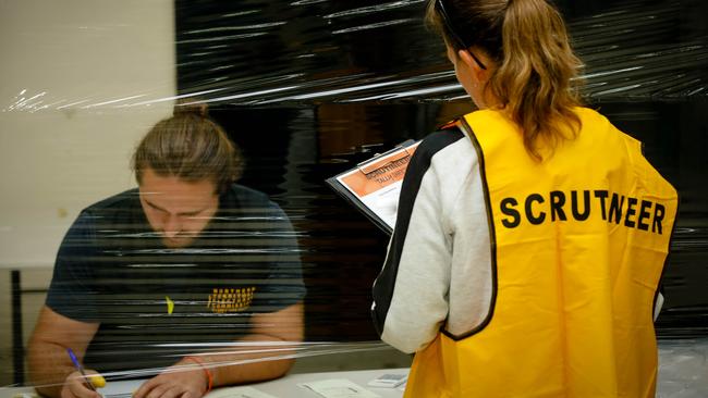 NTEC counter Janusz Kania as the NTEC is rechecking and vote counting continues in Darwin. Picture: GLENN CAMPBELL