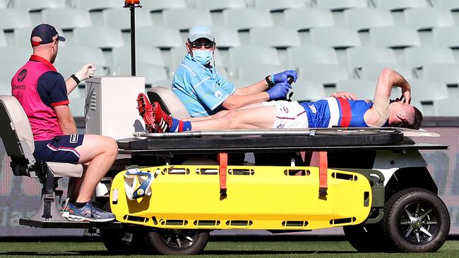 McLean is stretchered from the field after almost the entire Bulldogs squad got around him. Picture: Sarah Reed