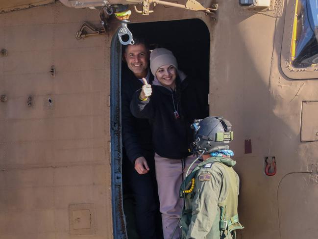 TOPSHOT - Newly released Israeli hostage Daniella Gilboa, gestures as she leaves a military helicopter upon landing at the Beilinson Hospital in Petah Tikva on January 25, 2025. Four young women soldiers, abducted by Palestinian militants on October 7, 2023 while serving near the Gaza border, were released on January 25, following more than 15 months in captivity. (Photo by Yossi ZAMIR / AFP)