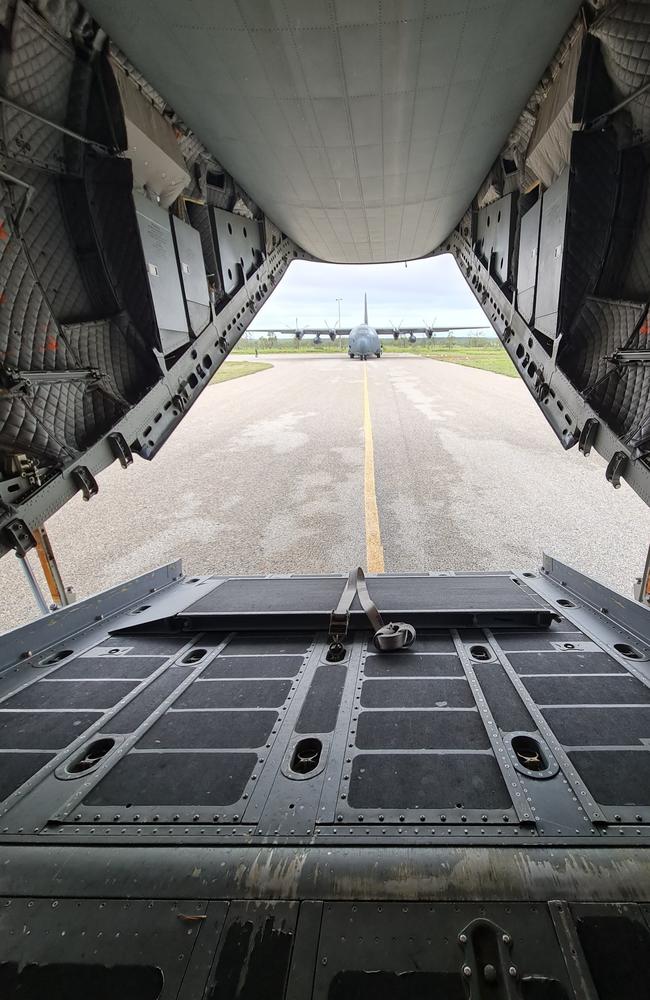 A Royal Australian Air Force C-130J Hercules aircraft sits on the Kalkarindji (Kalkgurung) Aerodrome ready to evacuate local residents during major flooding in the Northern Territory.