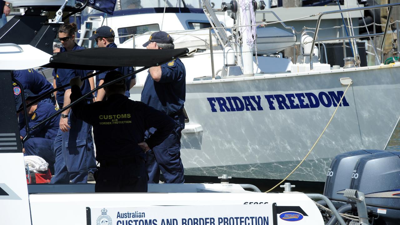 BIG TIME BUST: Australian Federal Police and Customs officials swoop on Friday Freedom at the Port Marina to inspect what is allegedly said to be a massive concealment of drugs. Photo: Max Fleet/NewsMail