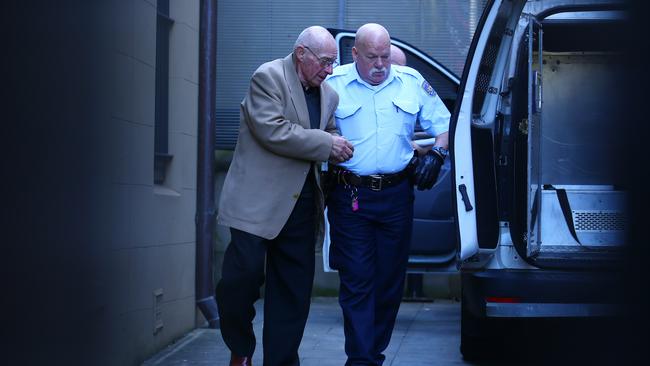 Rogerson being escorted from King St court in Sydney after being found guilty of the murder of student Jamie Gao. Picture: Britta Campion / The Australian.
