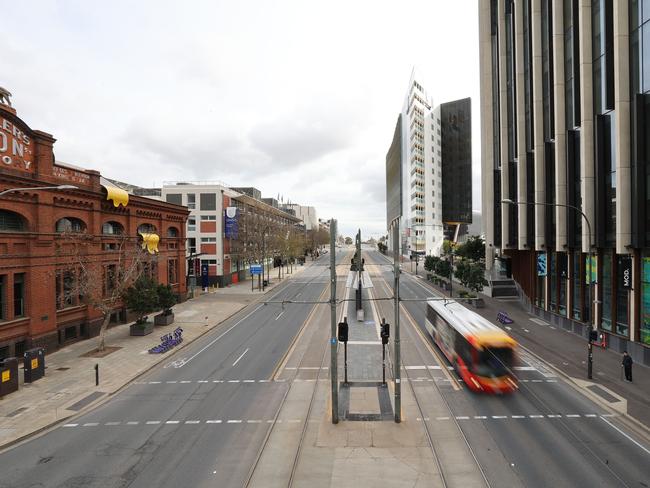 A bus heads down an otherwise empty North Tce on Wednesday, July 21. Picture: NCA NewsWire / David Mariuz