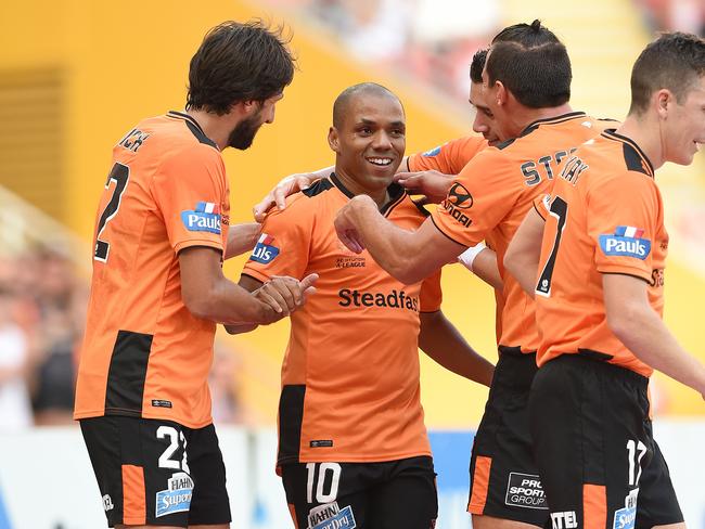 Roar player Henrique (centre) celebrates Brisbane’s second.
