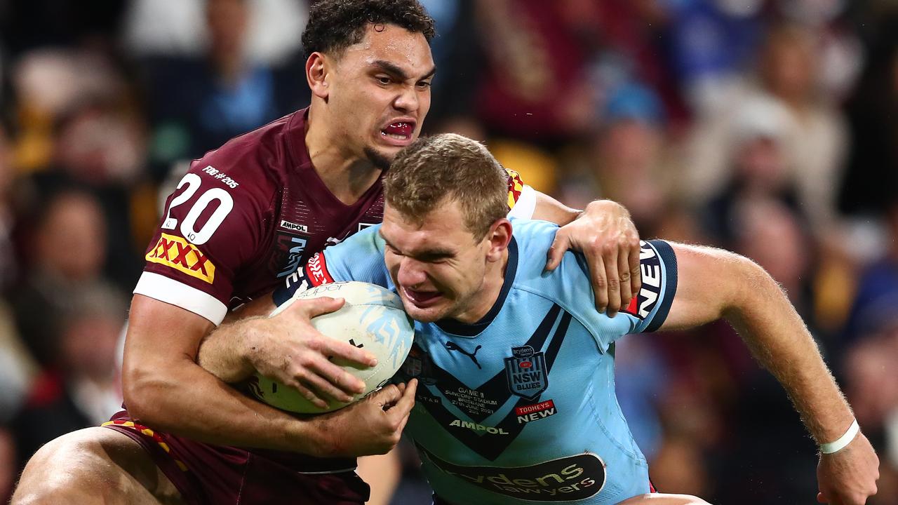 BRISBANE, AUSTRALIA - JUNE 27: Tom Trbojevic of the Blues is tackled during game two of the 2021 State of Origin series between the Queensland Maroons and the New South Wales Blues at Suncorp Stadium on June 27, 2021 in Brisbane, Australia. (Photo by Chris Hyde/Getty Images)