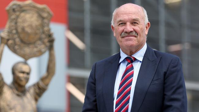 NRL legend Wally Lewis next to his iconic statue at Suncorp Stadium. Picture: Tara Croser.