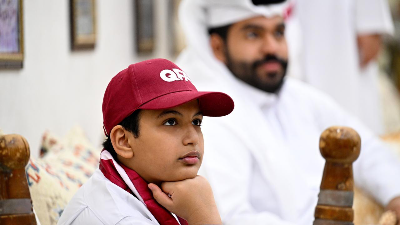 A Qatari family watches the opening game of the FIFA World Cup Qatar 2022 on November 20. Picture: Stuart Franklin/Getty Images