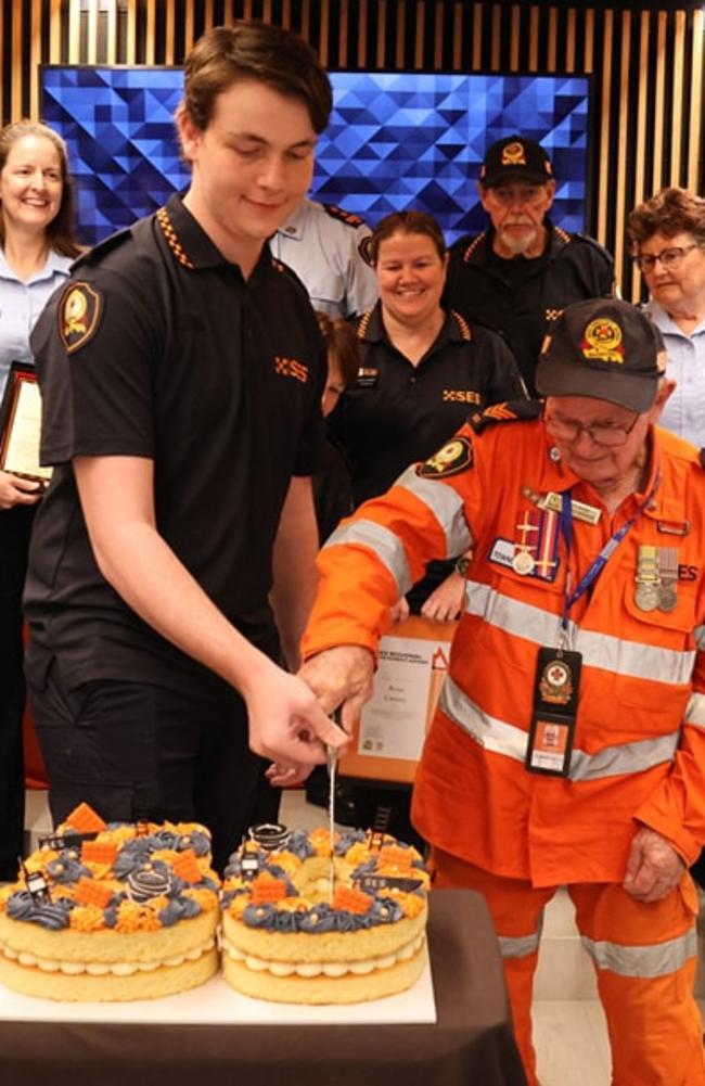 Micah Graffin cuts the cake with life member Jimmy Osborne (Townsville SES).