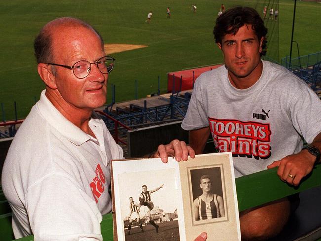 Feb96- John Beveridge former footballer pictured with his son Luke holds a some old photos of his father Jack who played for Collingwood in the 30's. Luke will play for St.Kilda like his father./afl/aussie rules football