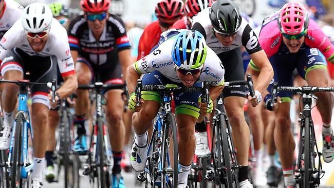 Caleb Ewan, leaning a long way forward on his bike, wins Stage 1 of the 2016 TDU. Picture: Sarah Reed