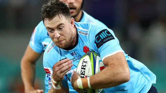 SYDNEY, AUSTRALIA - APRIL 20: Jed Holloway of the Waratahs is tackled during the round 10 Super Rugby match between the Waratahs and the Melbourne Rebels at the Sydney Cricket Ground on April 20, 2019 in Sydney, Australia. (Photo by Cameron Spencer/Getty Images)