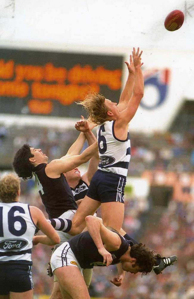 John Barnes soars over Justin Madden and Stephen Kernahan  in the 1994 semi final at Waverley.