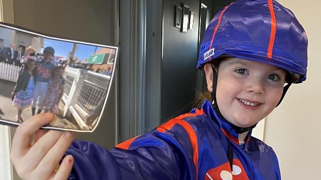 Six-year-old Juliette Saville dresses as champion jockey Jamie Kah.