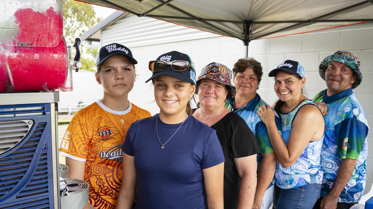 Serving ice-cold slush puppies at the Goondir Health Services Big Buddy stall are (from left) Peppa Collins, Annabell Washington, Sherilee Laine, Veronica Holland, Dionne Connolly and Firebrace Wharton at the Warriors Reconciliation Carnival women's games at Jack Martin Centre hosted by Toowoomba Warriors, Saturday, January 18, 2025. Picture: Kevin Farmer