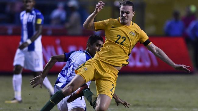 Jackson Irvine sldies in to beat the Honduras defence.