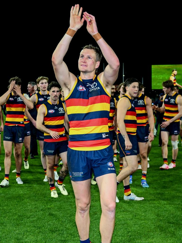 Crows captain Jordan Dawson othanks the fans as the Crows leave the ground after winning the round 22 AFL match between Adelaide Crows and Western Bulldogs at Adelaide Oval. Picture: Mark Brake/Getty Images