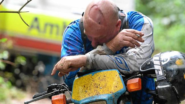 Heartbreaking scenes as rider (pictured) mourns the loss of his friend at Imbil State Forest. Picture: Troy Jegers