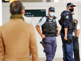 DAILY TELEGRAPH - Commuters at Central station pictured after a mandatory mask etiquette was brought into place due to COVID-19. Police officers remind public they need to wear a mask. Picture: Sam Ruttyn