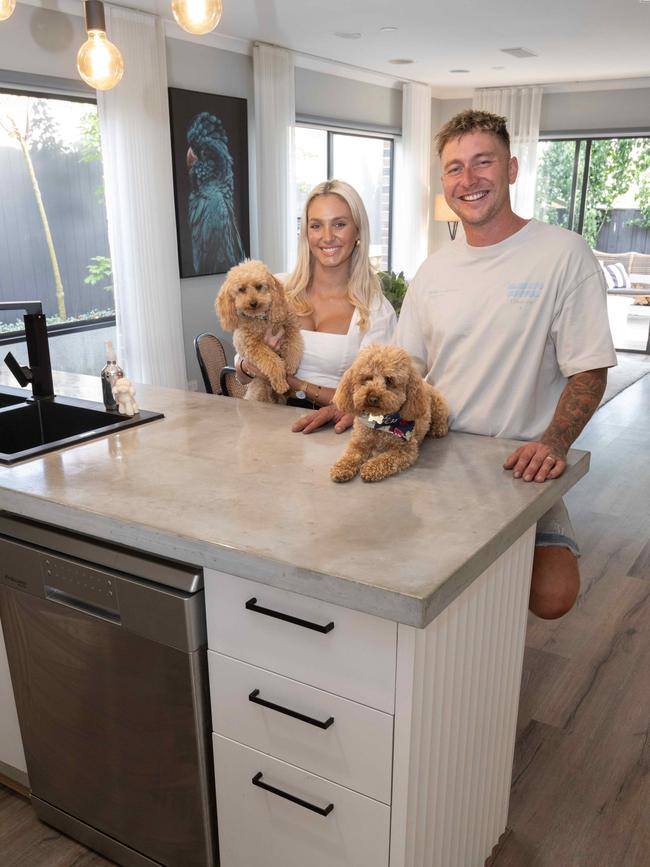 Polished concrete benches and scalloped cladding feature in the kitchen. Picture: Tony Gough.