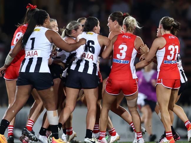 Swans and Pies players clash. Picture: Getty Images