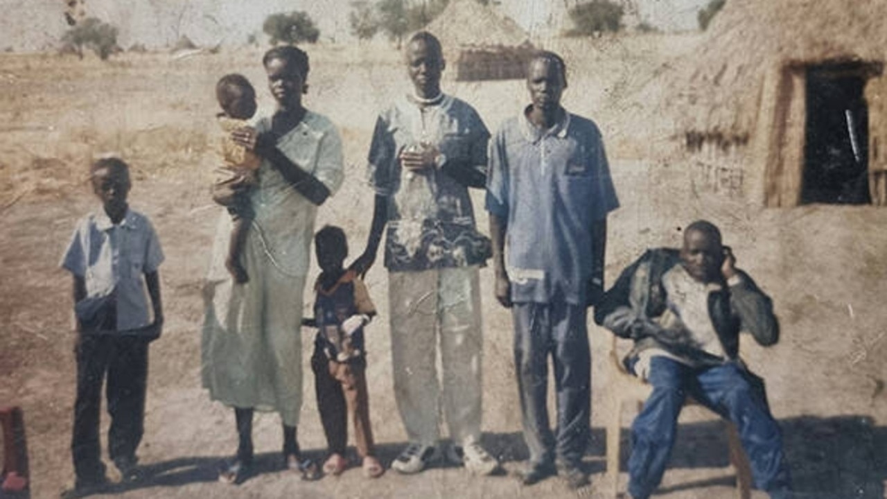 Nyakuoy Yak (pictured in 1998 as a baby) escaped with her family from Sudan to Australia in 2005. Nyakuoy said many of her family members (pictured) were displaced and/or killed in the country's civil war.