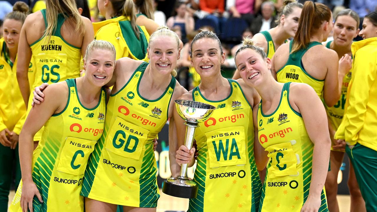 (L-R) Courtney Bruce, Jo Weston, Liz Watson, and Jamie-Lee Price of Australia pose for a photo with the Constellation Cup as they celebrate victory after the Constellation Cup match between the Australia Diamonds and New Zealand Silver Ferns. (Photo by Bradley Kanaris/Getty Images)