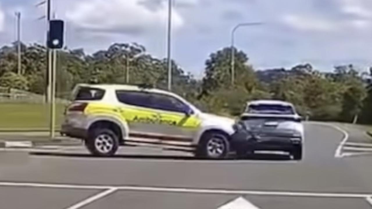 Watch: Moment ambulance slams into car at busy intersection